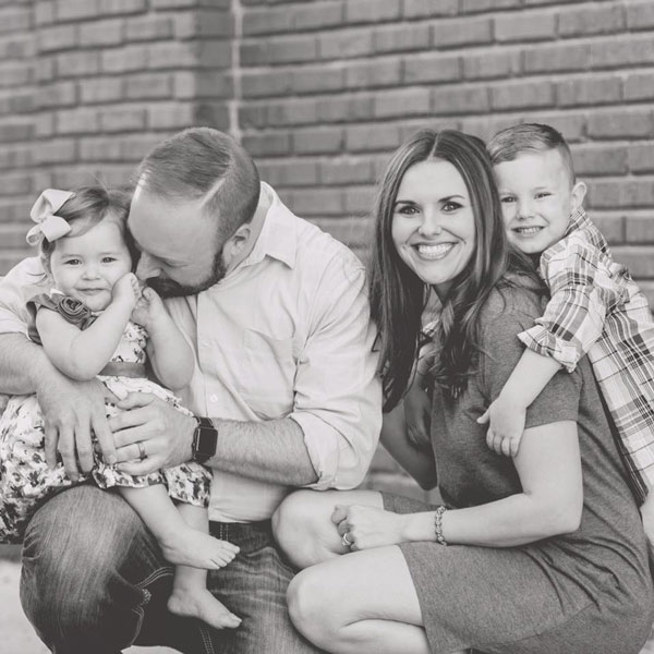 doctor and family smiling for portrait