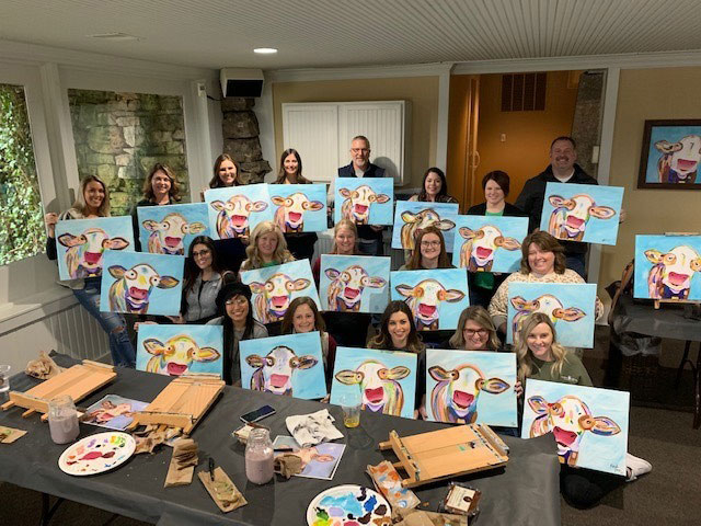 staff painted cows group photo